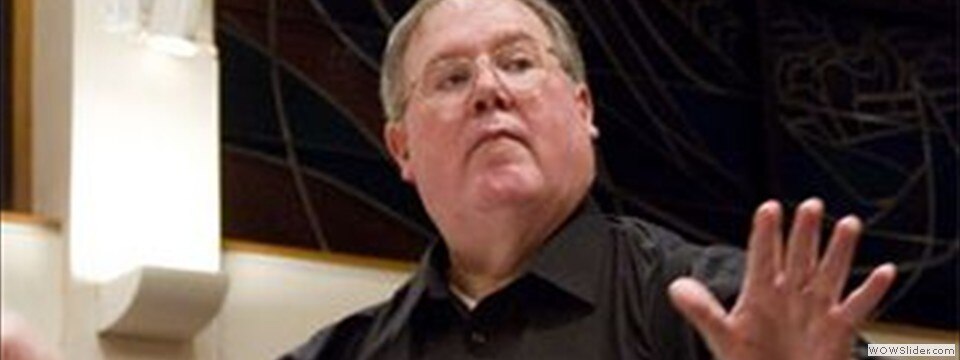 Close up of Bob Webb conducting.