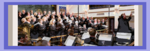 Bob Webb conducting the Northern VA Chorale in lively fashion, facing audience